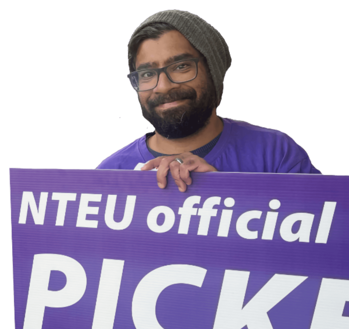 NTEU male member with beard and beanie smiling and holding an NTEU picket placard